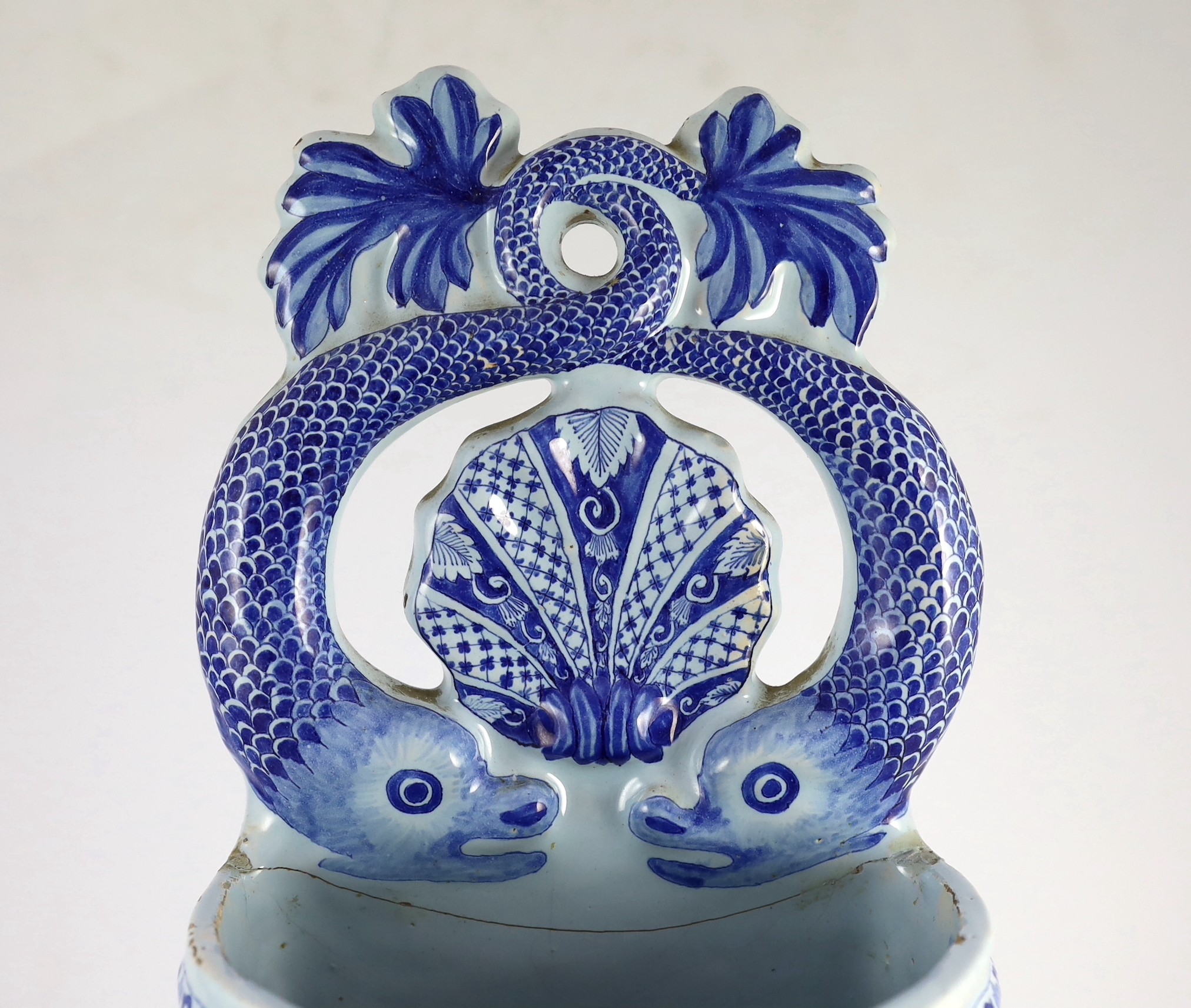 A large Rouen faience blue and white cistern, second quarter 18th century, 57.5cms high 57.5cm high, restorations